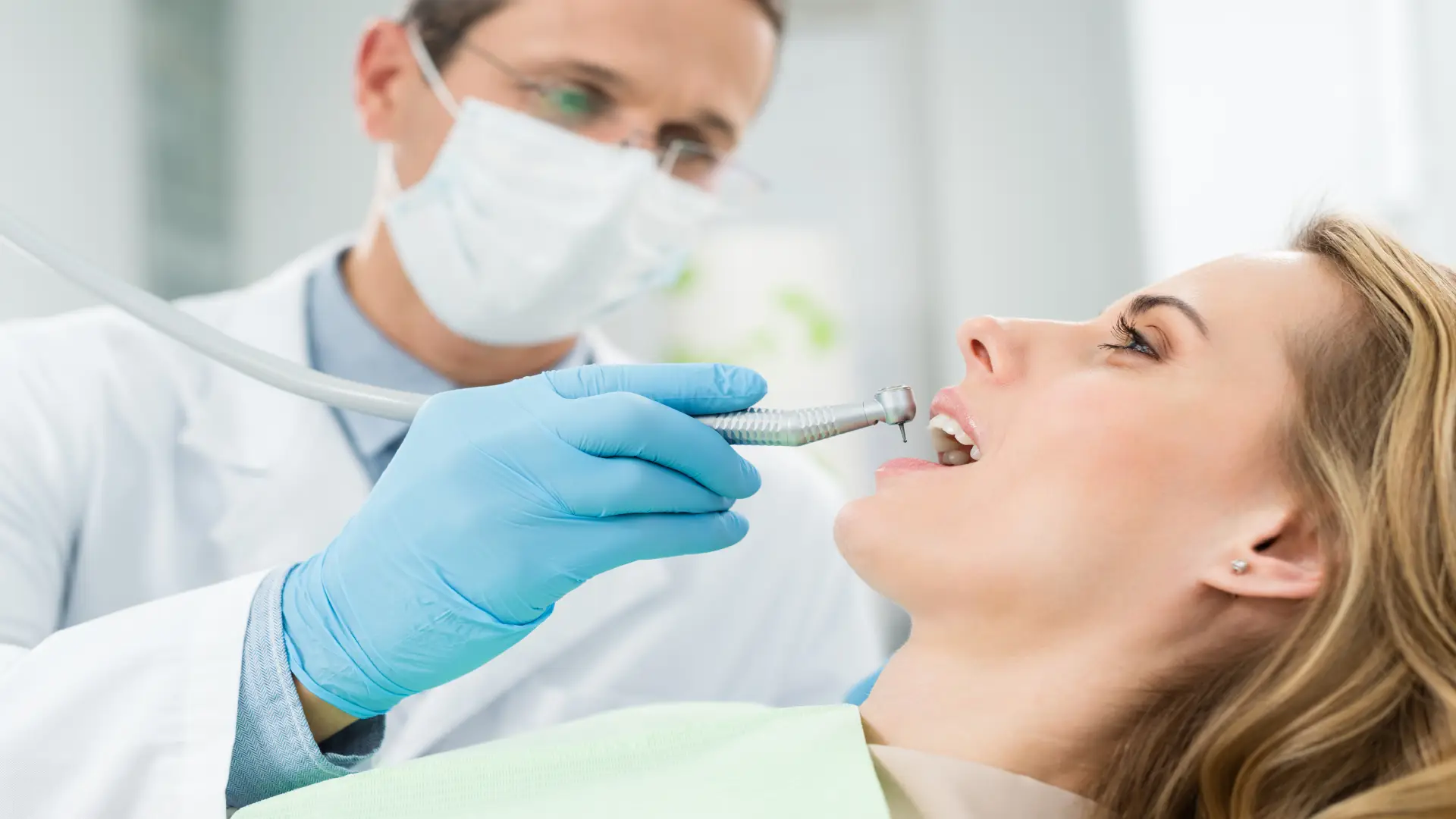 female-patient-at-dental-procedure-using-dental-dr-2022-12-16-18-15-05-utc.webp